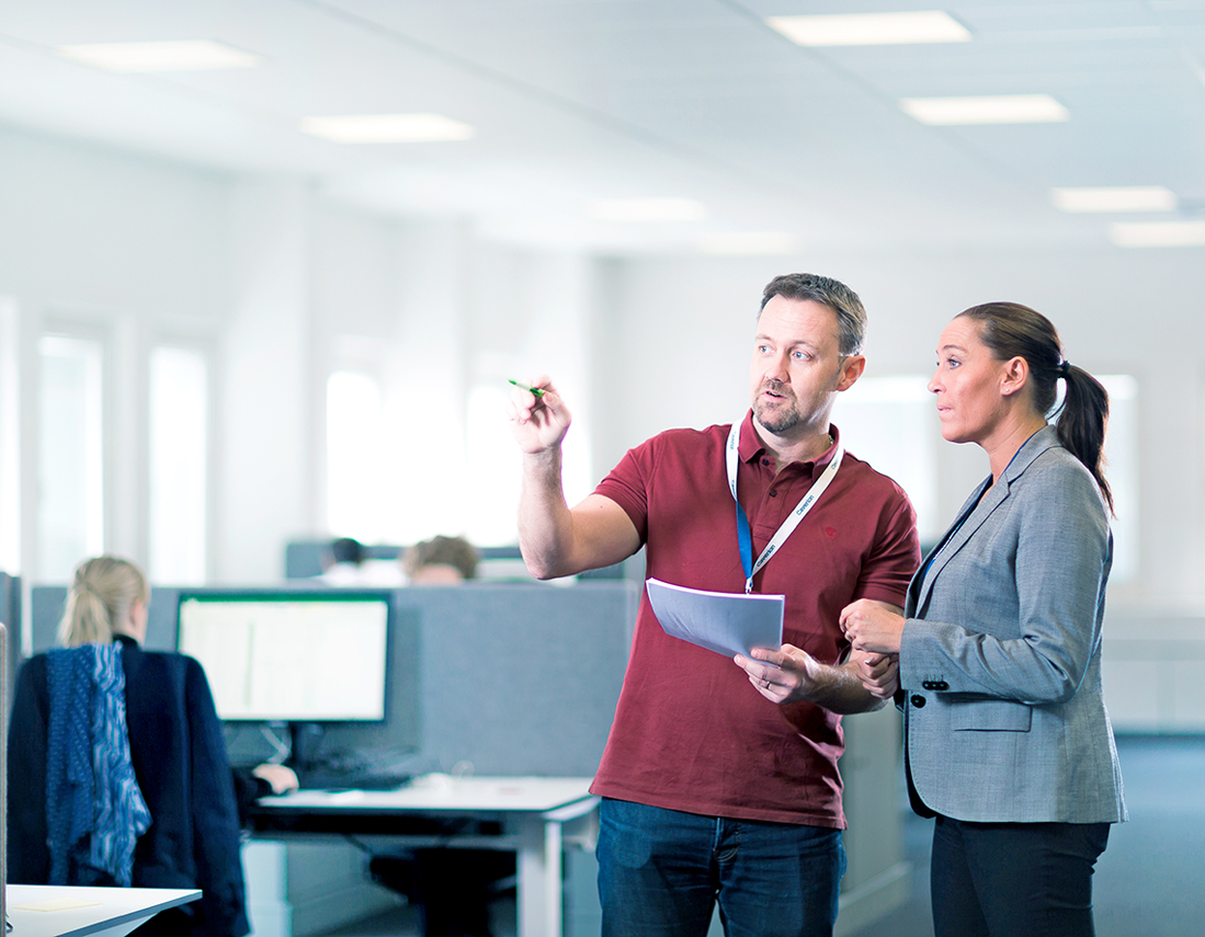service-workers-looking-at-phone.jpg