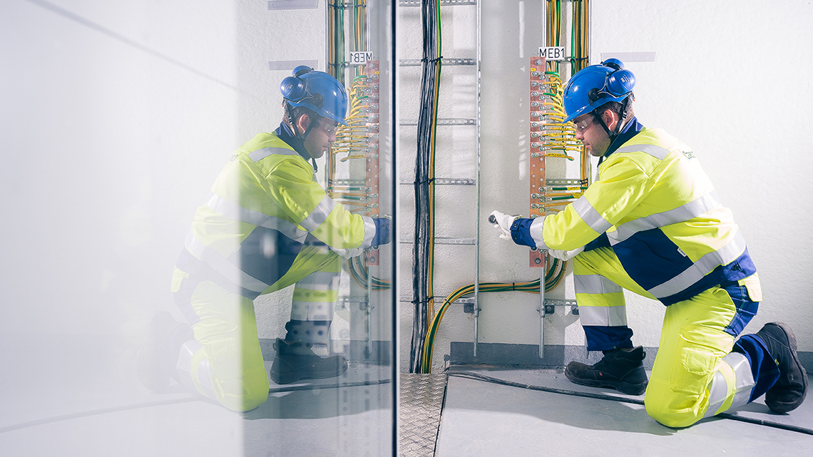 service-workers-looking-at-phone.jpg