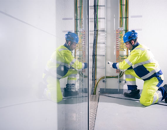 service-workers-looking-at-phone.jpg